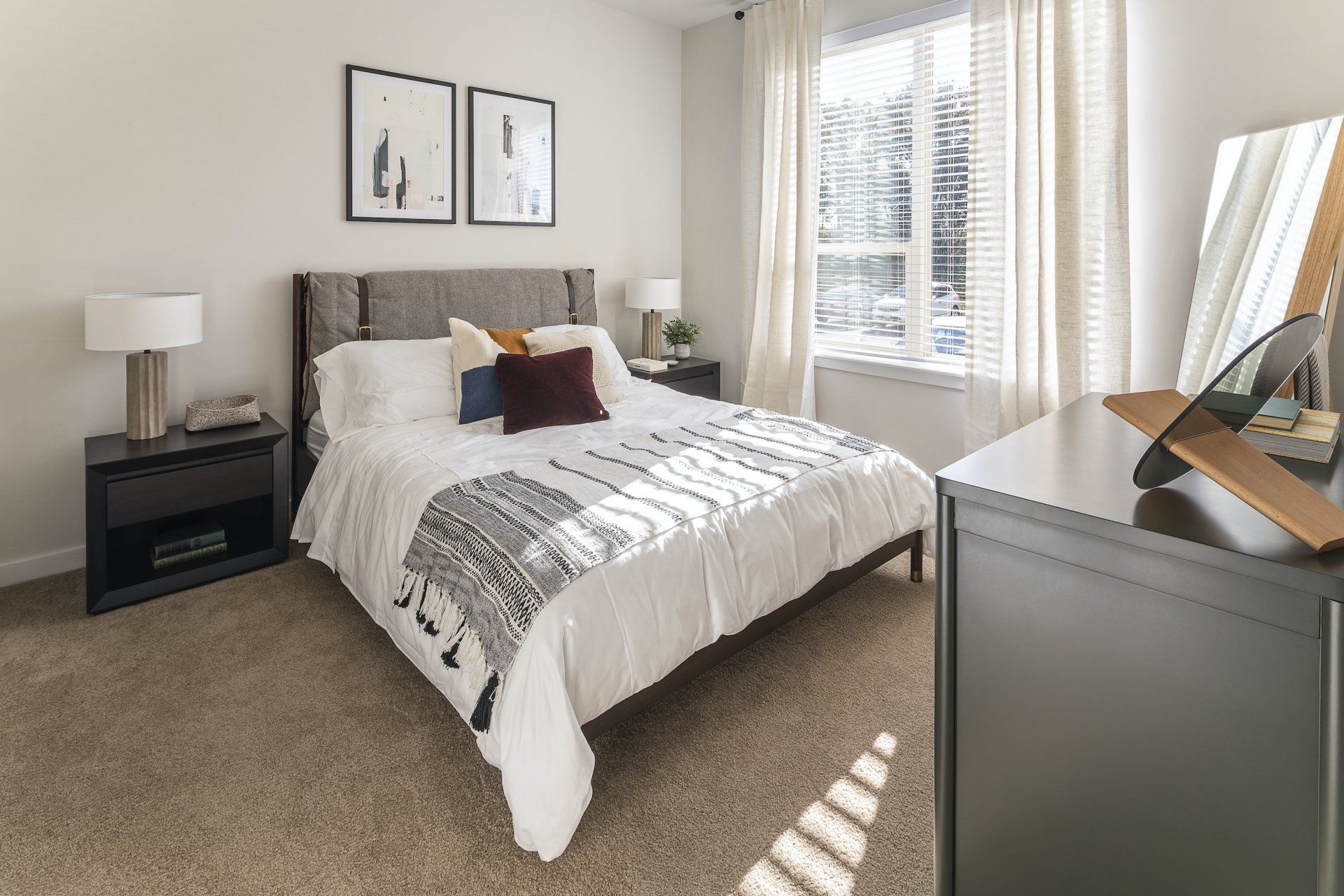 Carpeted bedroom with large window