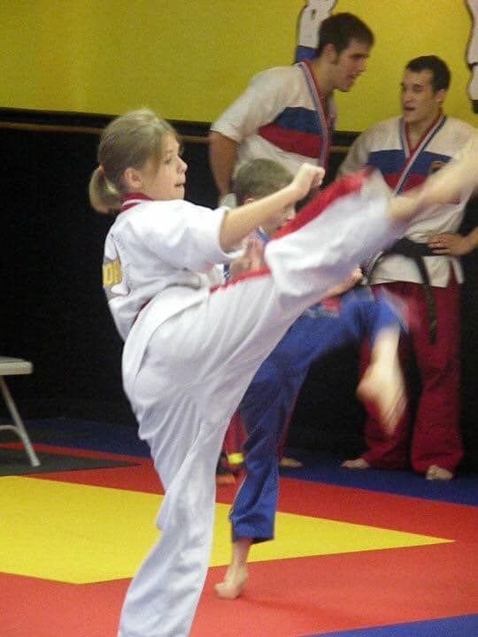 An aerial view of a city skyline at sunset.