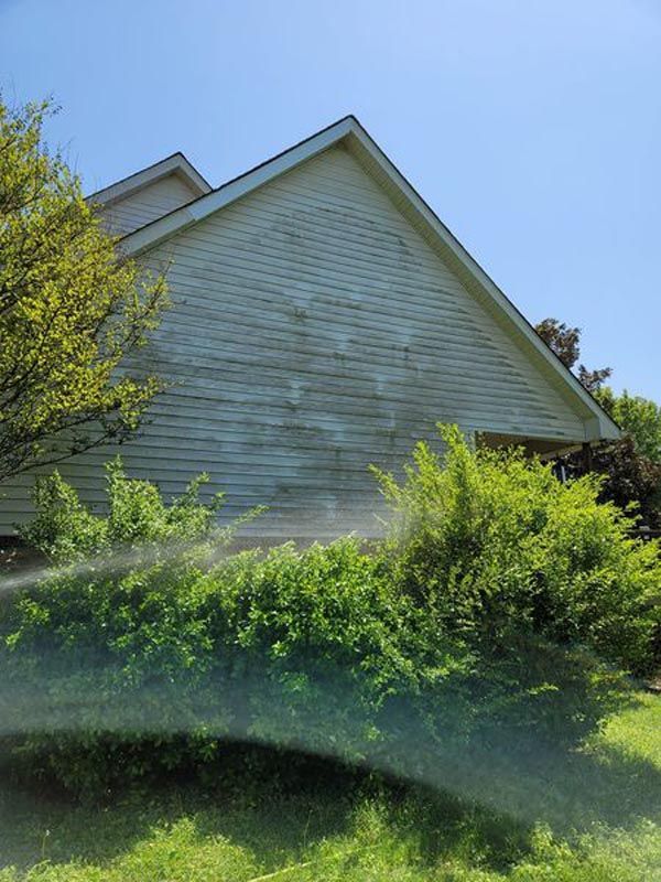 A white house with a blue sky in the background
