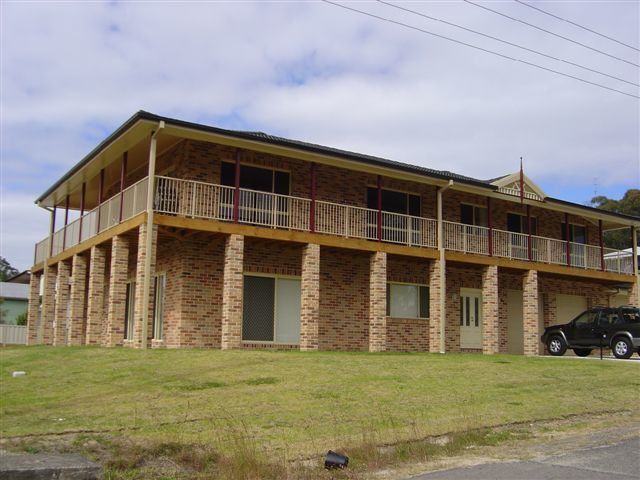 Large Brick House With Customised Fence — Decorative Aluminium Works In Cardiff, NSW