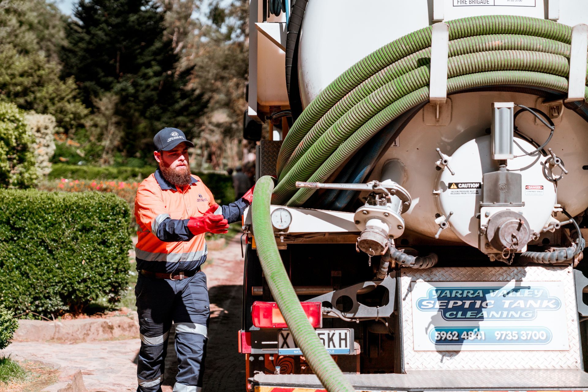 This is a photo image of a Yarra Valley Septics Truck driving through Healesville past the Healesville Grand Hotel. Yarra Valley Septic Tank Cleaning do residential & commercial liquid waste and sewage septic tank cleaning