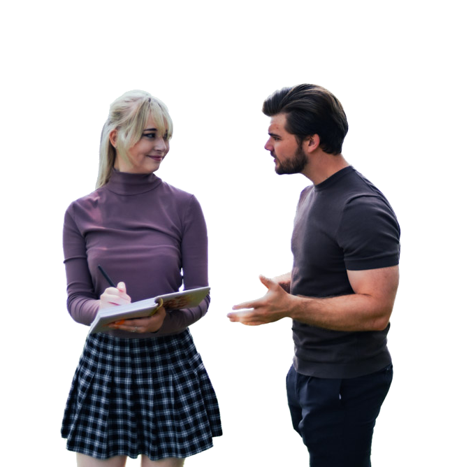 A couple of real estate agents in Rapid City stand next to each other and talk.