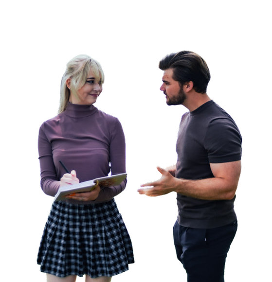 A top real estate agent in the Black Hills, SD, is talking to his wife, who is holding a clipboard
