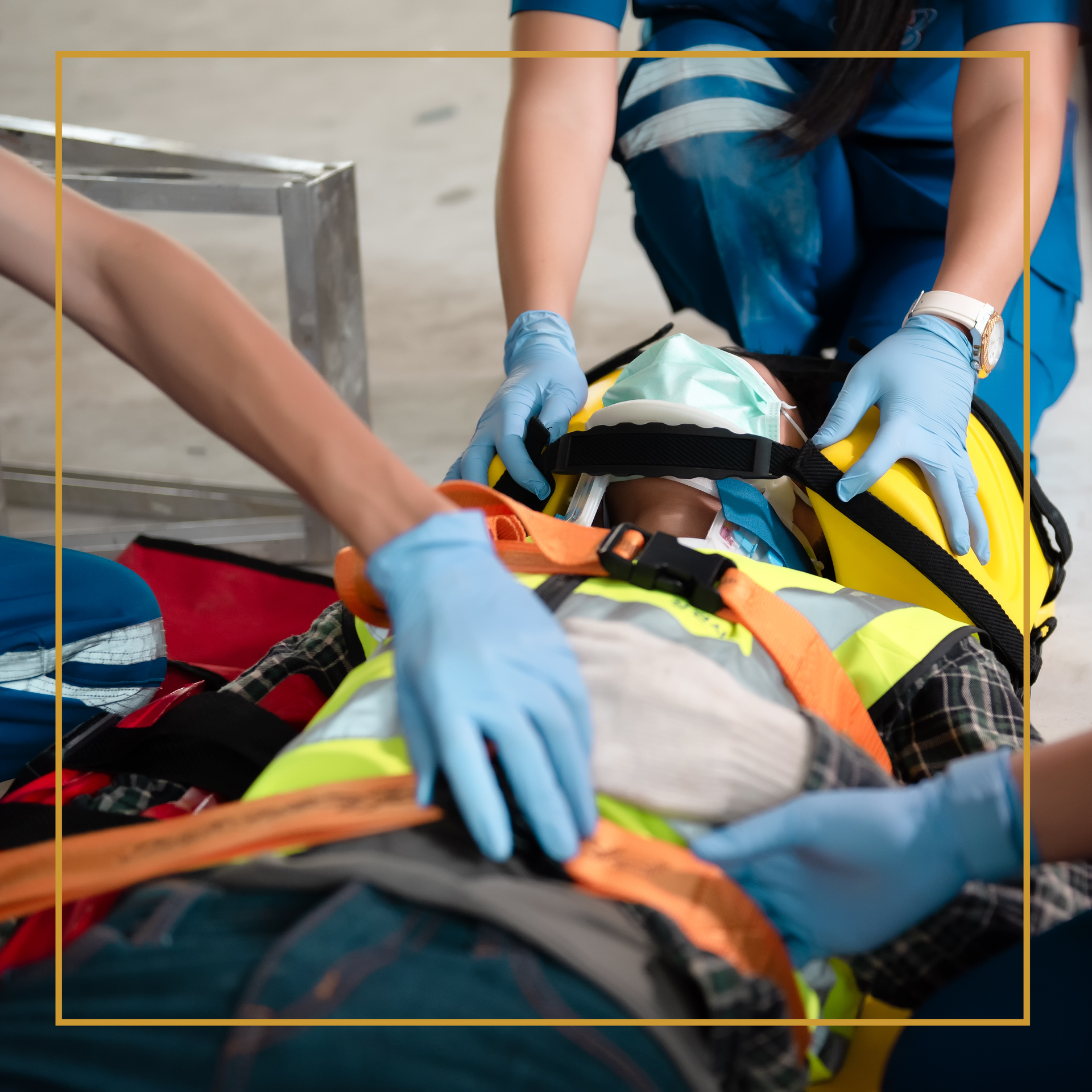 Medical personnel treating a person on a stretcher.