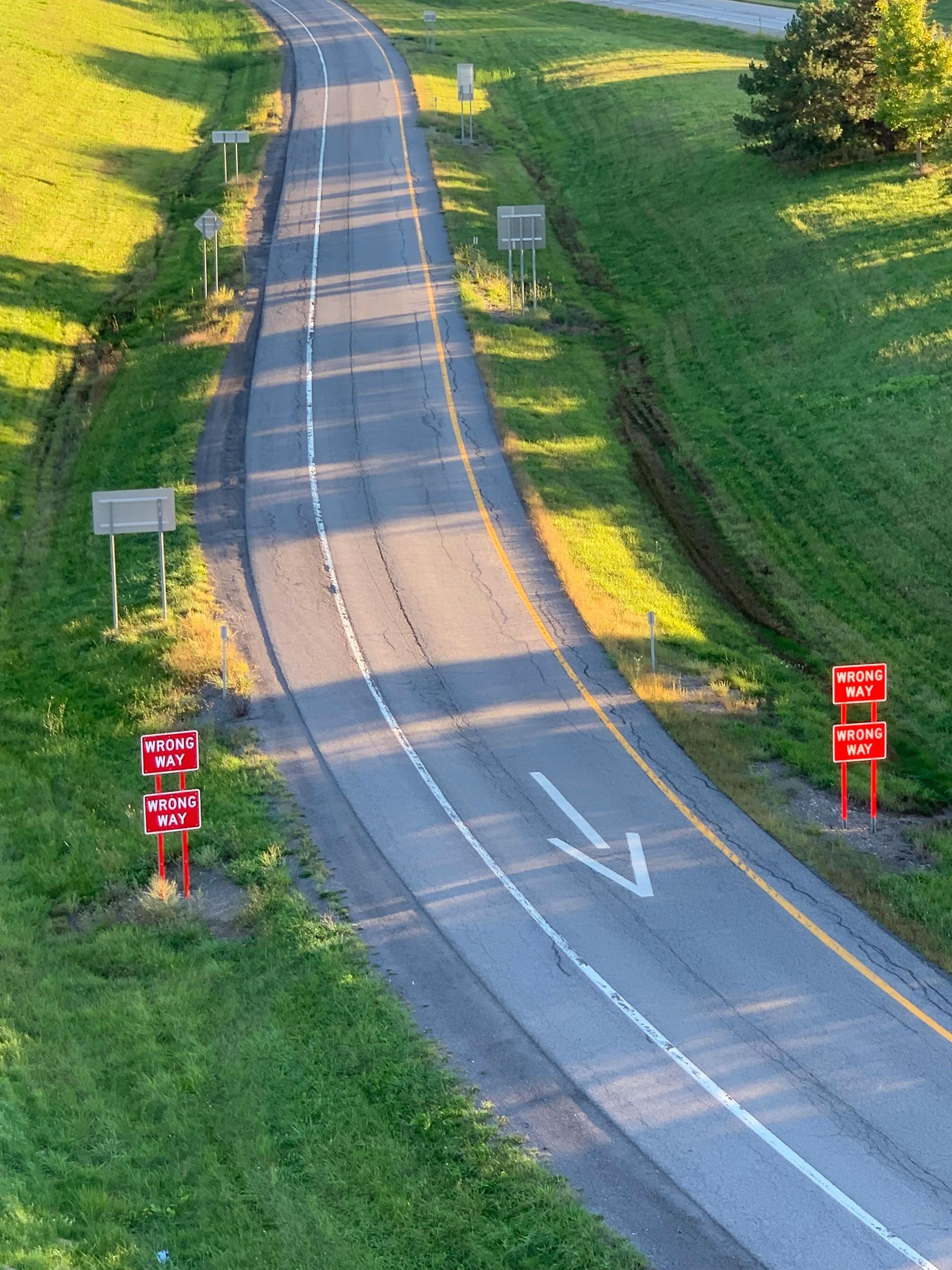 road with wrong way sign