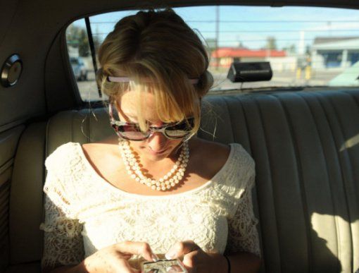 woman texting in a car