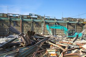 Asbestos removal site following demolition with regulated debris handling and cleanup