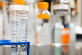 Laboratory chemicals being identified and packaged for DOT-compliant hazardous waste lab packing
