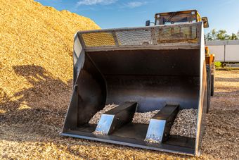Industrial equipment handling non-hazardous waste materials for compliant disposal and recycling