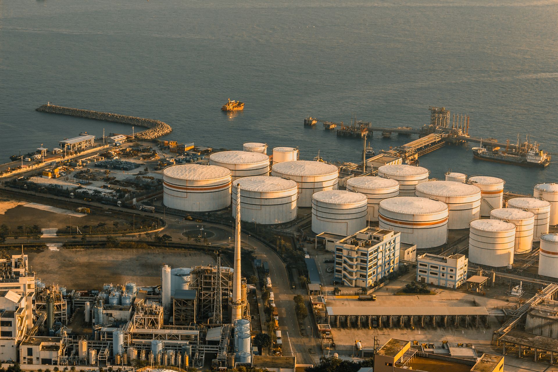 Aerial view of industrial oil storage tanks supporting bulk liquid waste handling and related industrial services