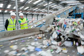 Industrial recycling facility sorting mixed industrial waste and recyclable materials for compliant material recovery