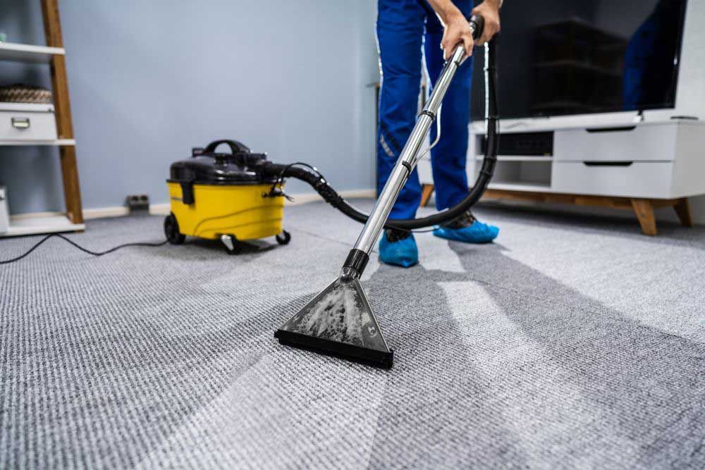 House Cleaner Cleaning Carpet