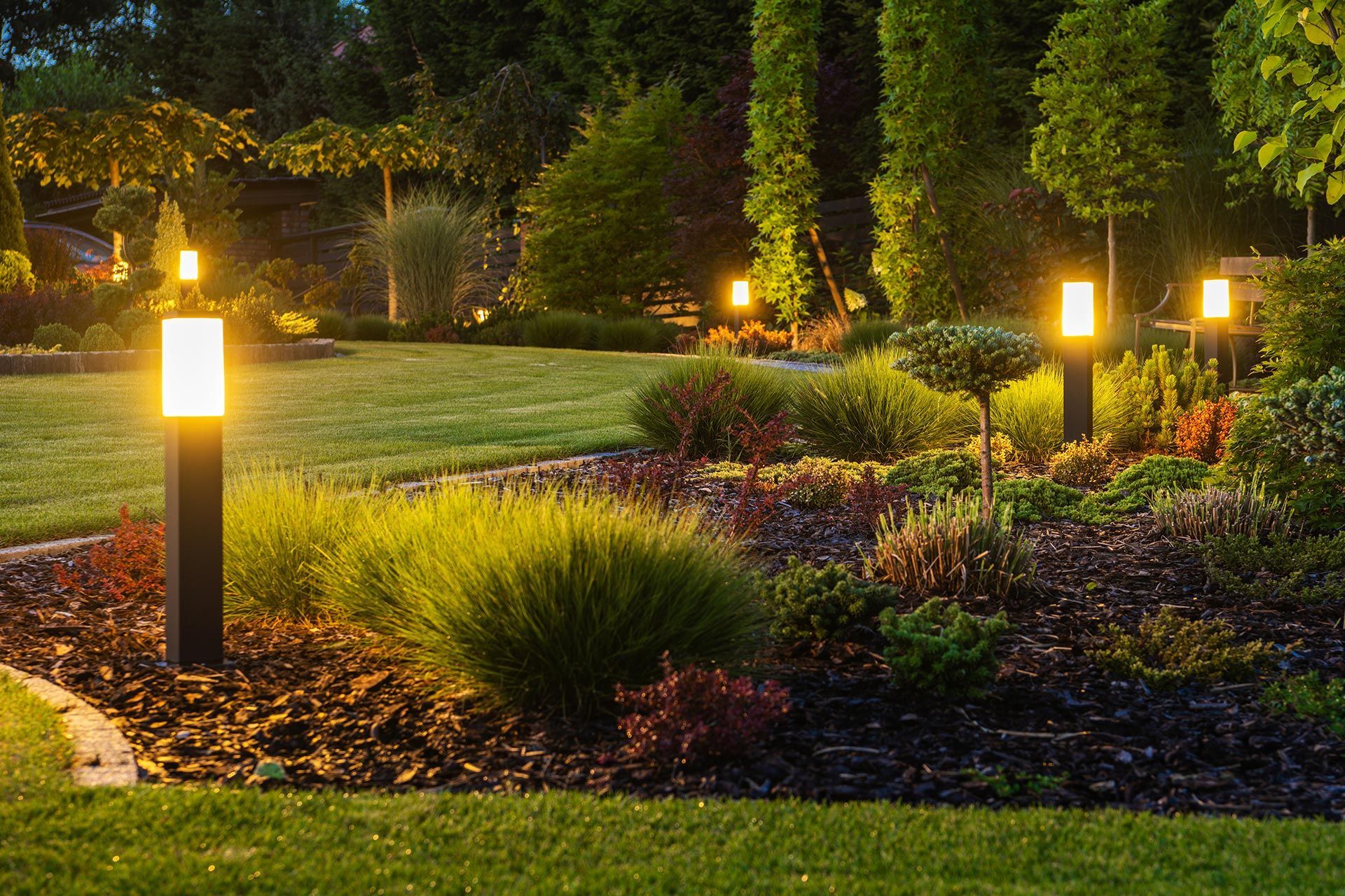 Beautiful residential patio with decorative outdoor lighting recently installed.