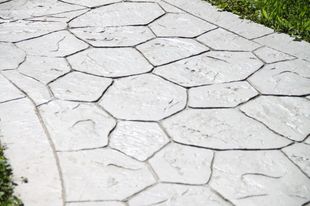 A concrete walkway with a hexagonal pattern on it.