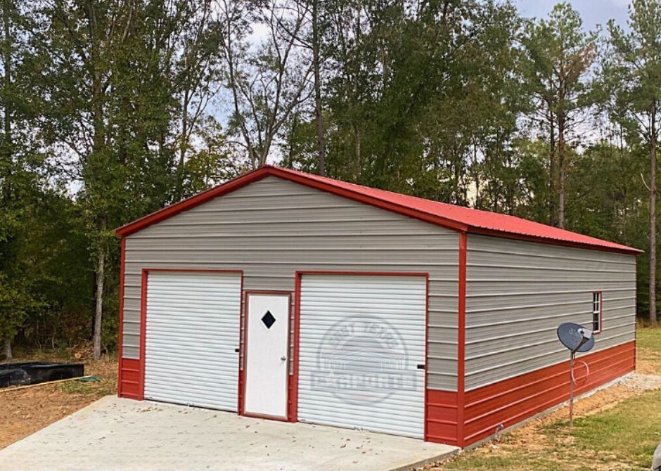 24 foot by 36 foot by 10 foot two car metal garage with a red A-frame vertical roof, two-tone gray and red siding with red trim, two roll up doors, one walk in door, and one window