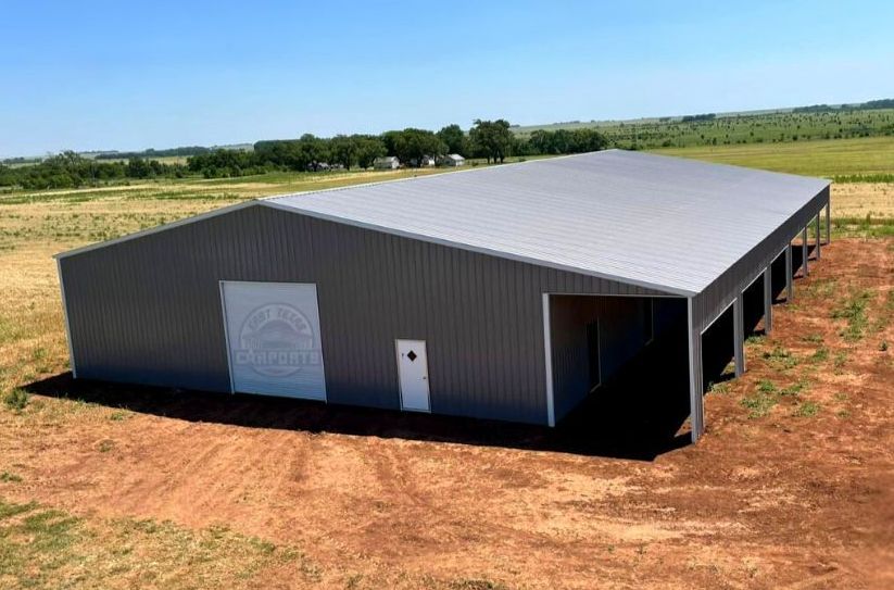 60'x120'x14'  All Vertical Panel Commercial Metal Building.  Grey with Grey trim, one roll up door, and one walk in door.