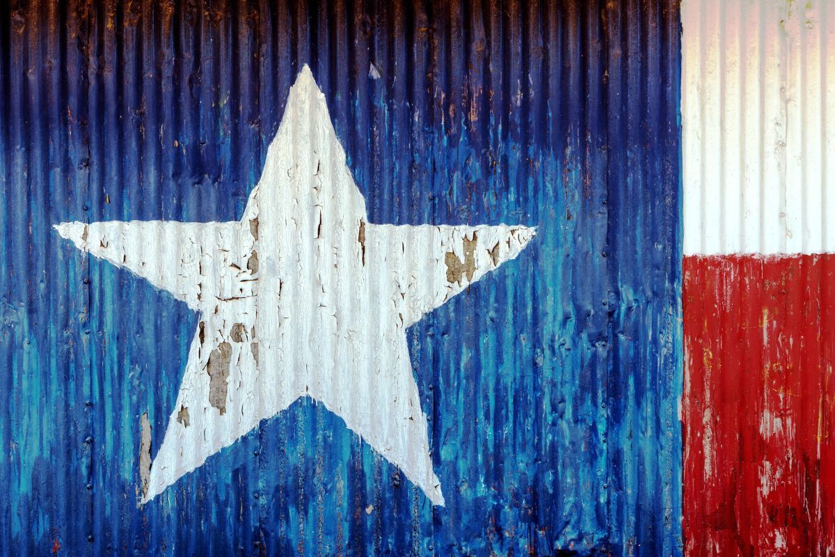 Texas flag painted on corrugated metal used to represent Big Spring, TX.