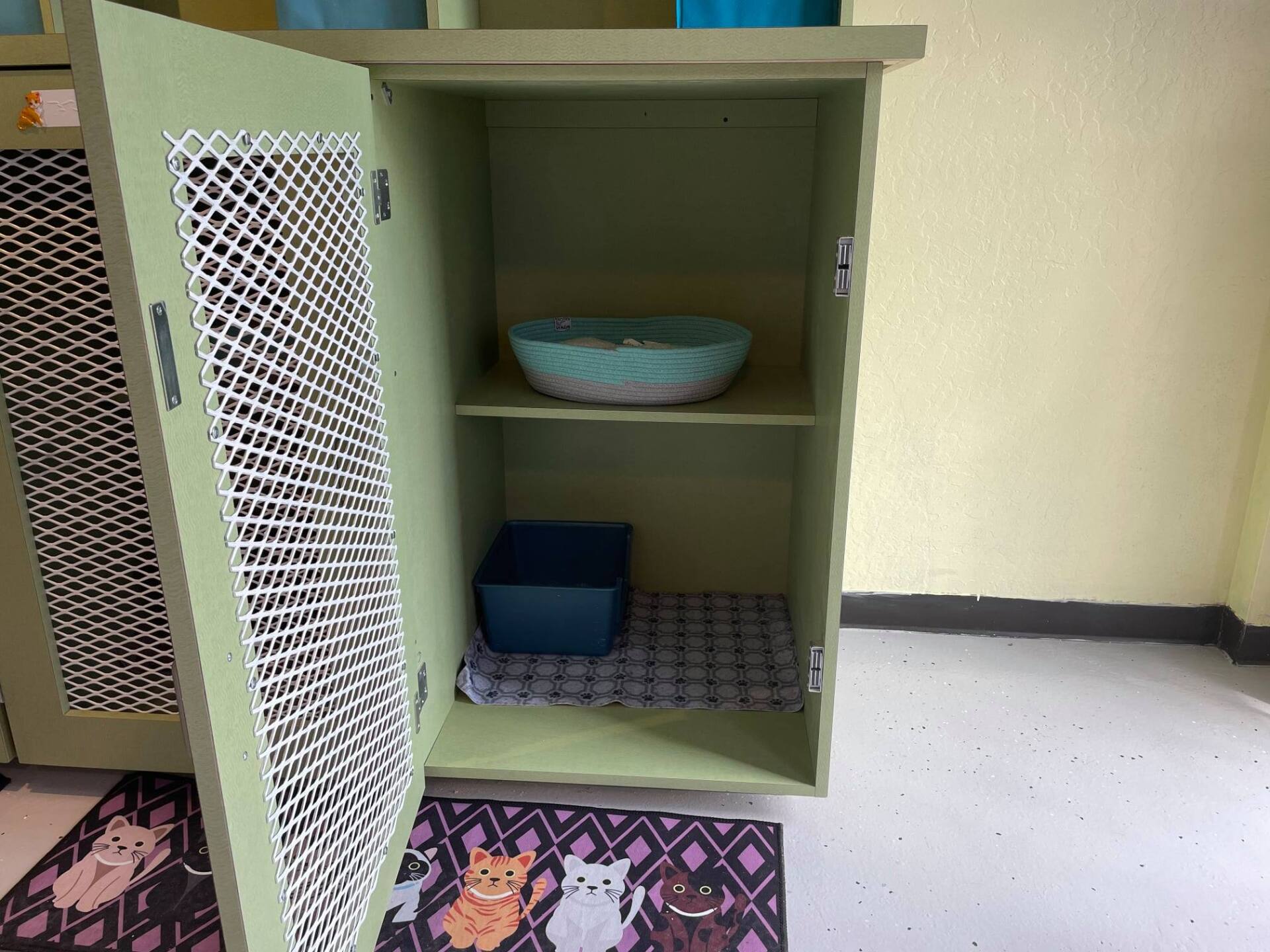 green painted gate and kennel