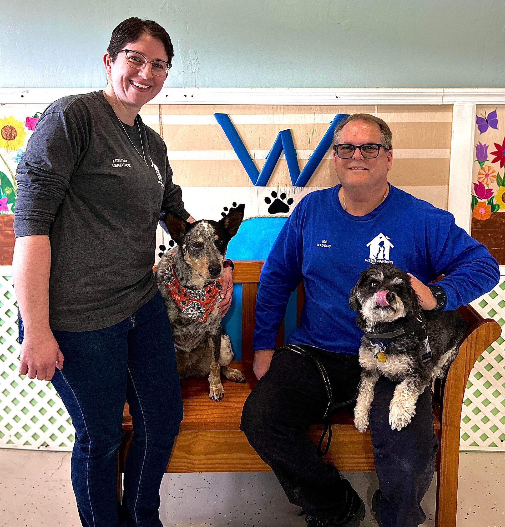 employees posing with dogs
