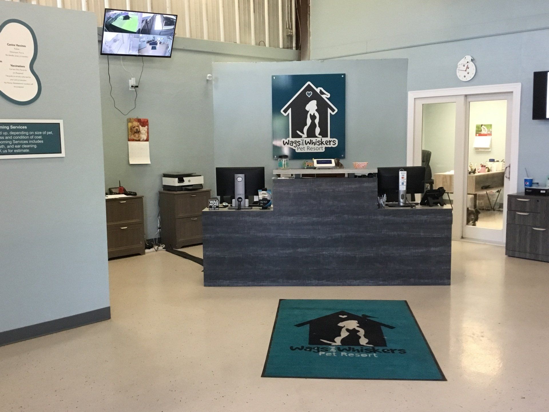 lobby with blue and green decoration and logo
