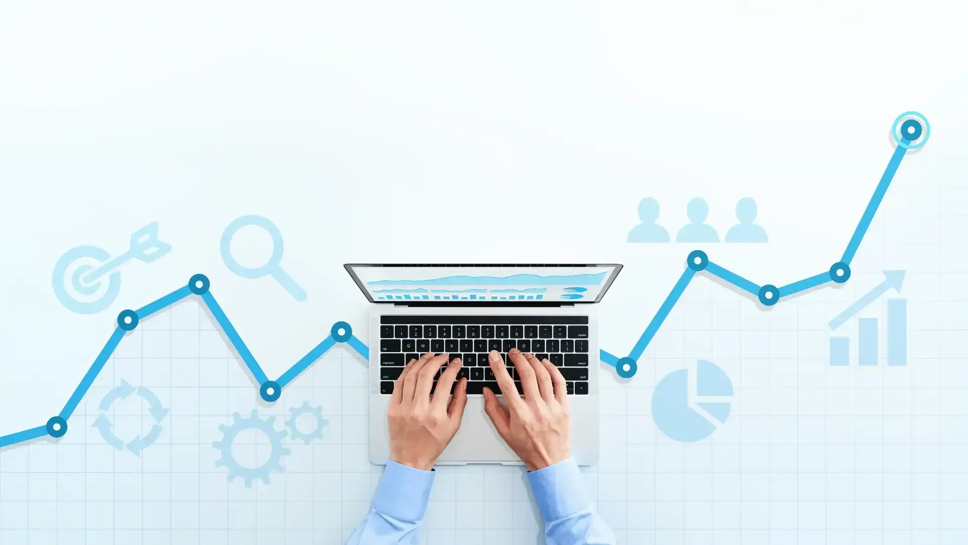 A person is typing on a laptop computer with a graph in the background.