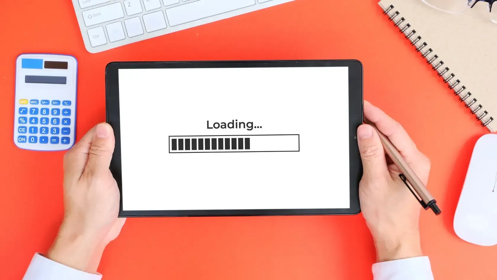 Hands holding tablet with 