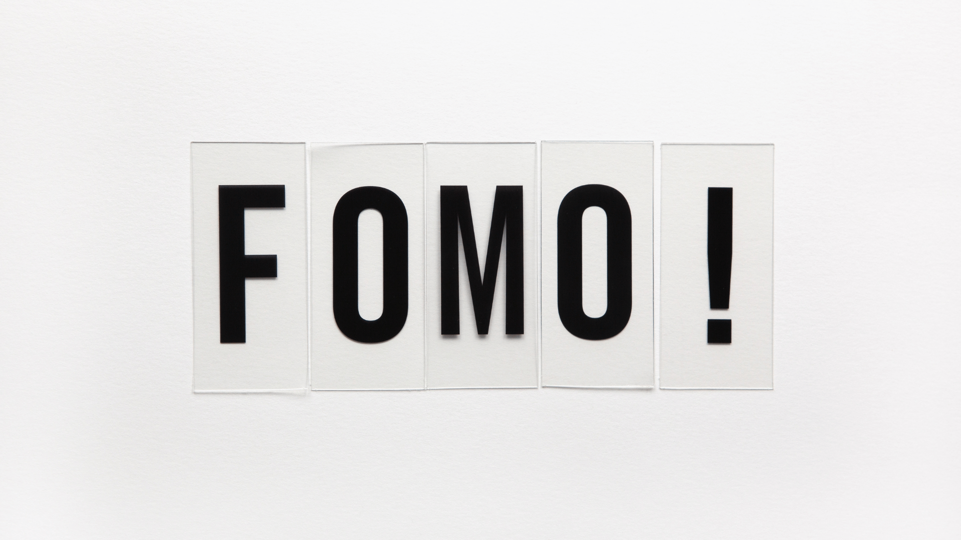 the word fomo is written in black letters on a white background .