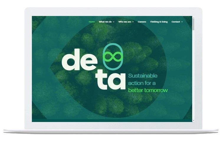 a laptop computer is open to a website that says de ta sustainable action for a better tomorrow .
