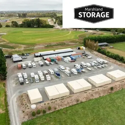 Aerial view of Marshland Storage facility with parked RVs, boats, and storage containers.