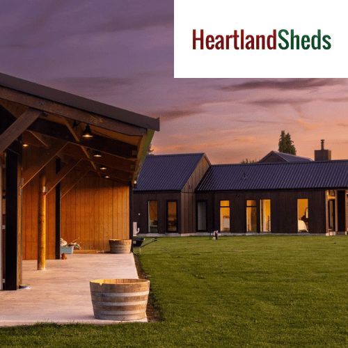 a picture of a house with a heartland sheds logo