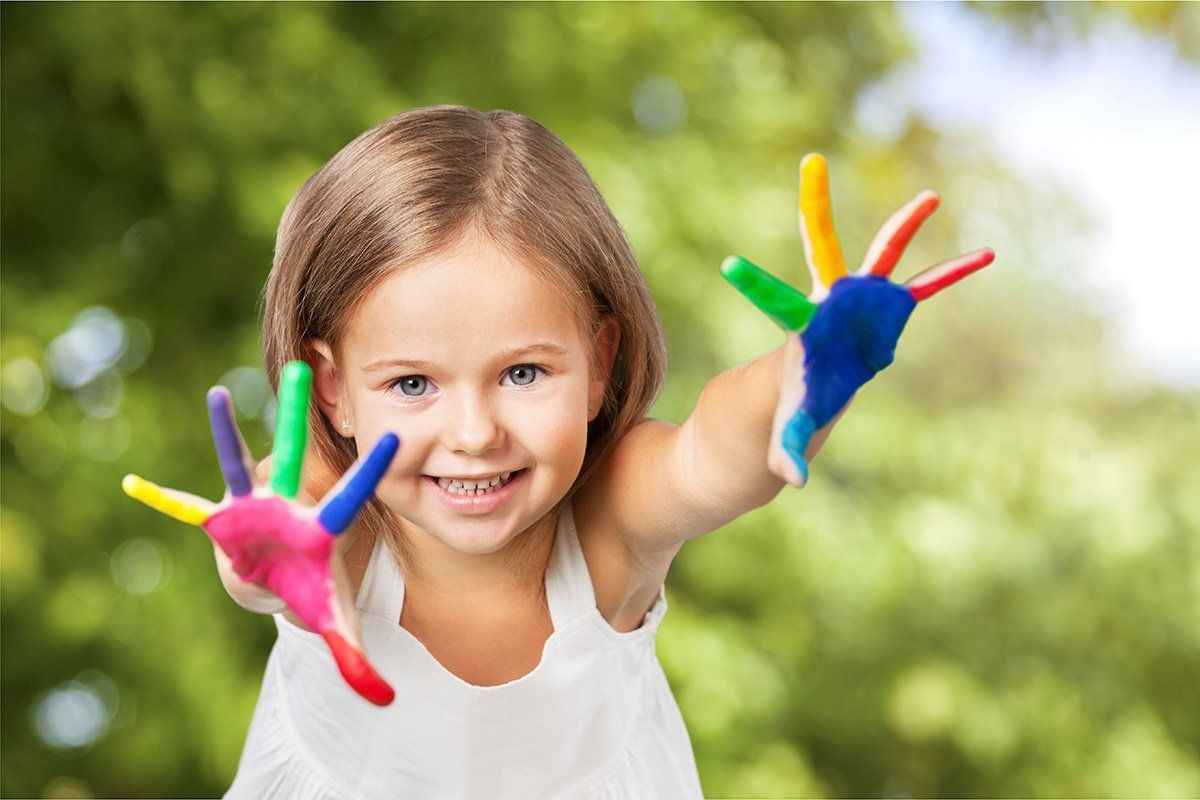 Little Girl with paint on hands