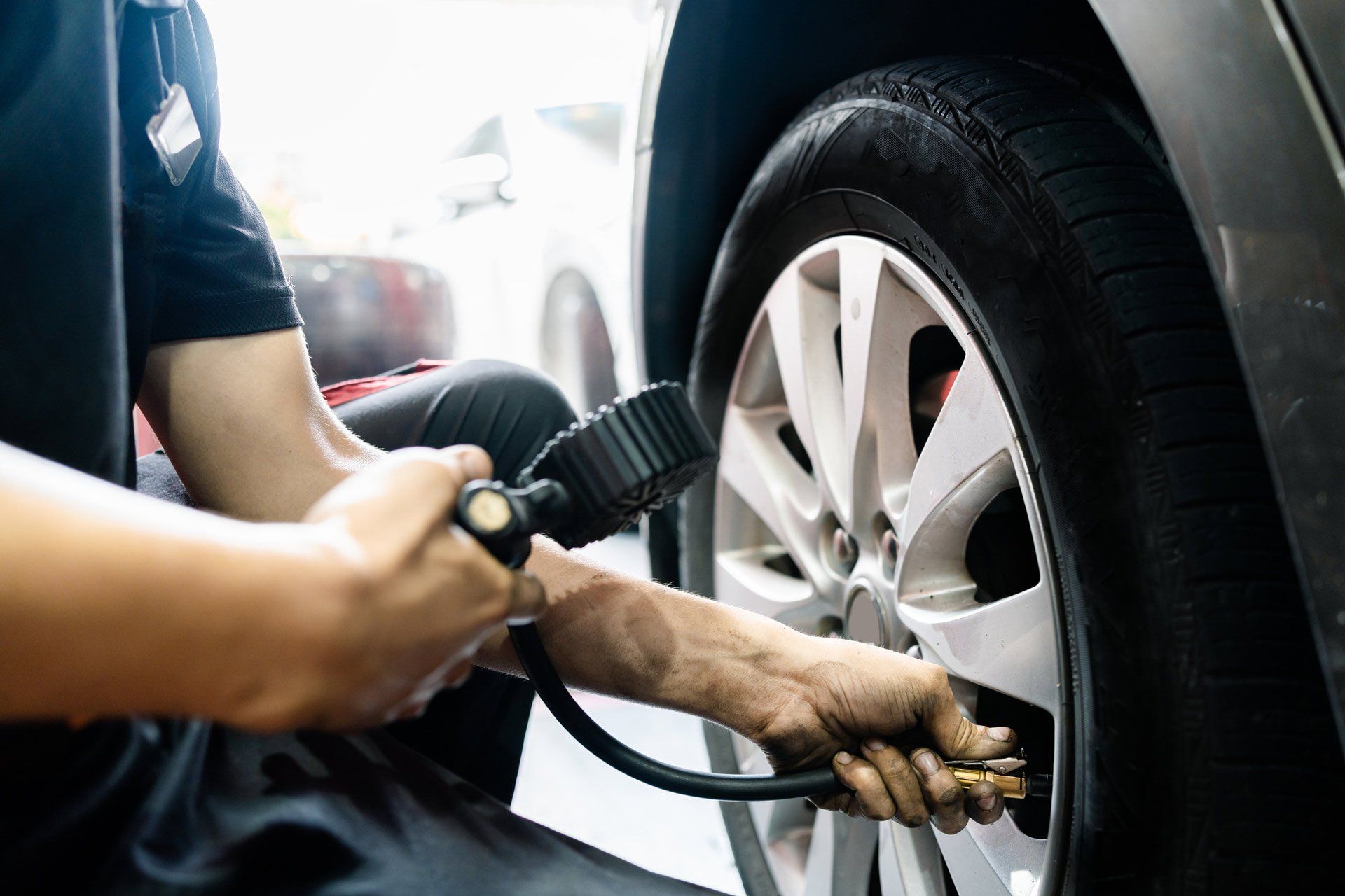 Mechanic Tyre Air Pressure Test in Auto Repair Shop | Helensvale, Qld | Ashtons Removals