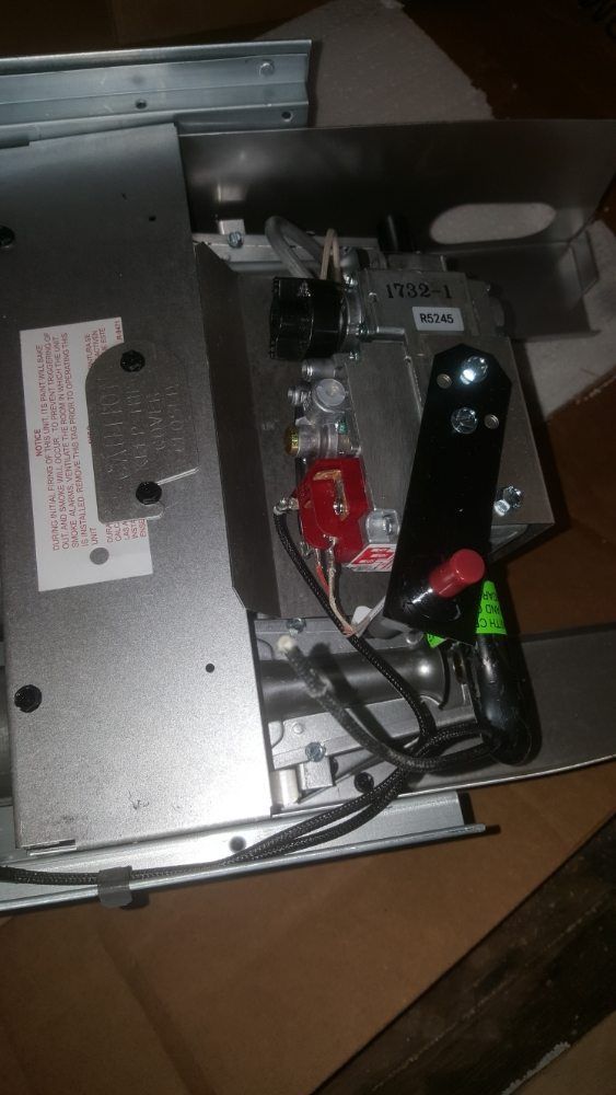 A close up of a piece of metal with wires coming out of it.