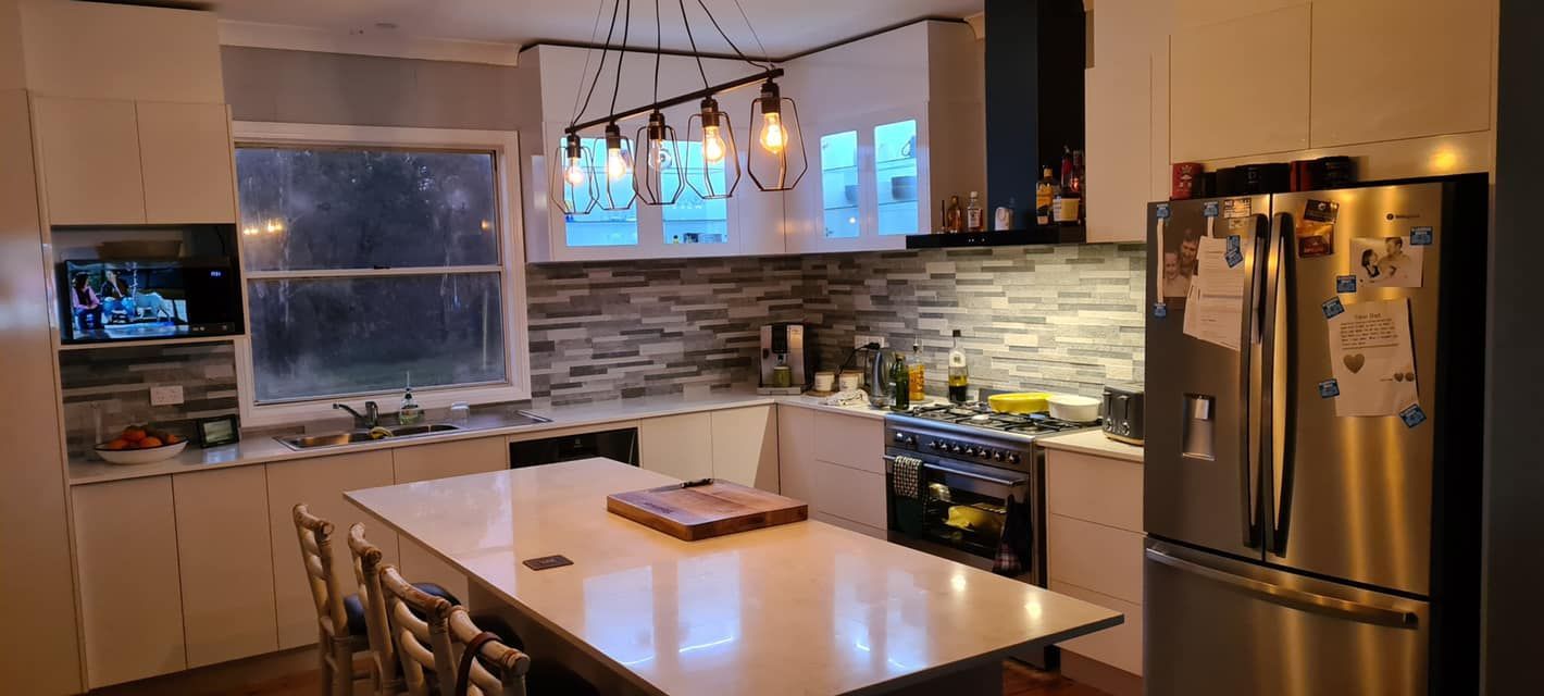 A Kitchen With Stainless Steel Appliances and a Large Island — 4Shaw Kitchens in Coonamble, NSW