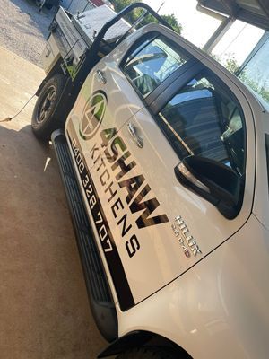 A White Truck with Shaw Sticker on Door is Parked in a Parking Lot — 4Shaw Kitchens in Dubbo, NSW