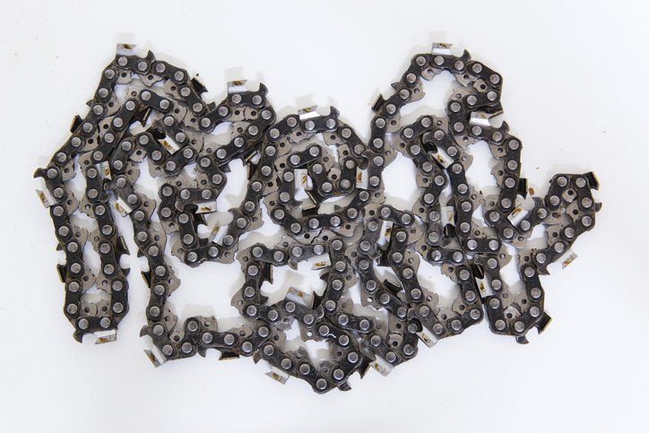 a close up of a chainsaw chain on a white background