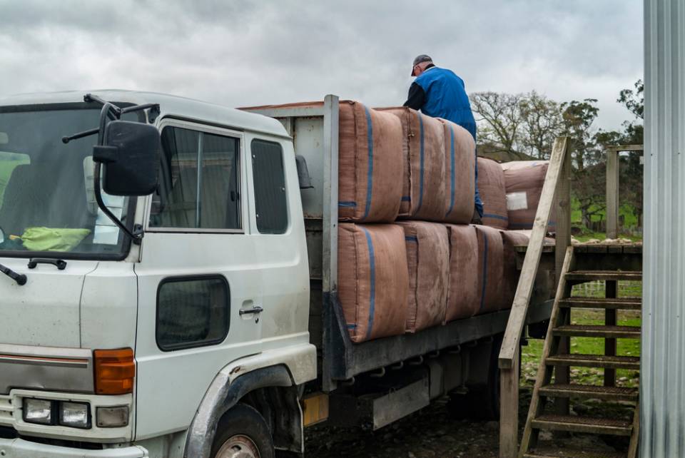 truck being loaded with goods