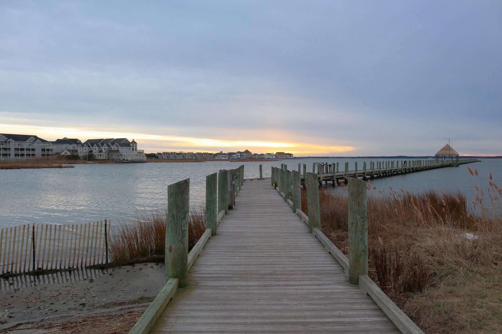 A wooden dock leading to a body of water
