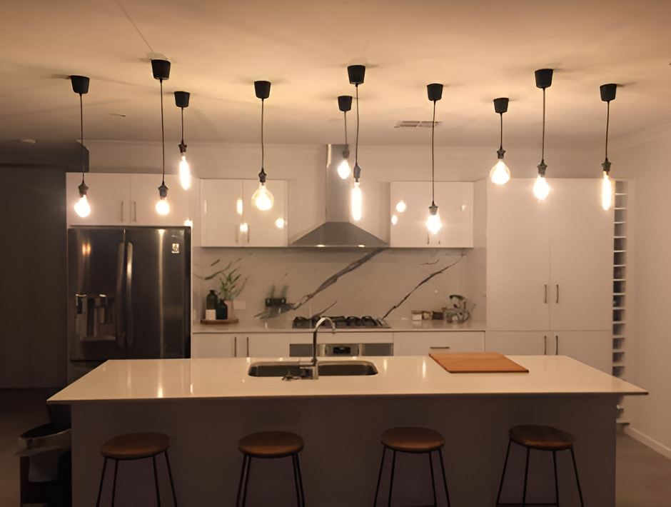 Modern Kitchen With White Island, Hanging Pendant Lights — Quik Fire Electrical in Kelmscott, WA