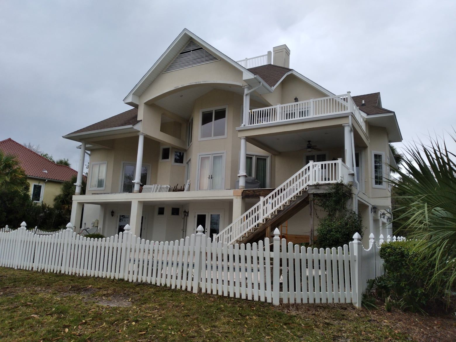 Home Exterior With Wood Fence