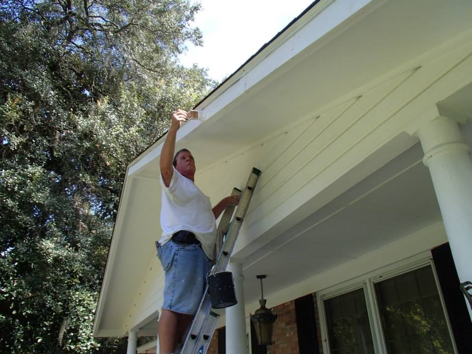 Man Painting House Exterior