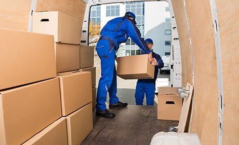 Men Loading Boxes — Interior Storage in Greeley, CO