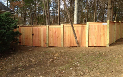 privacy fence with tree in background