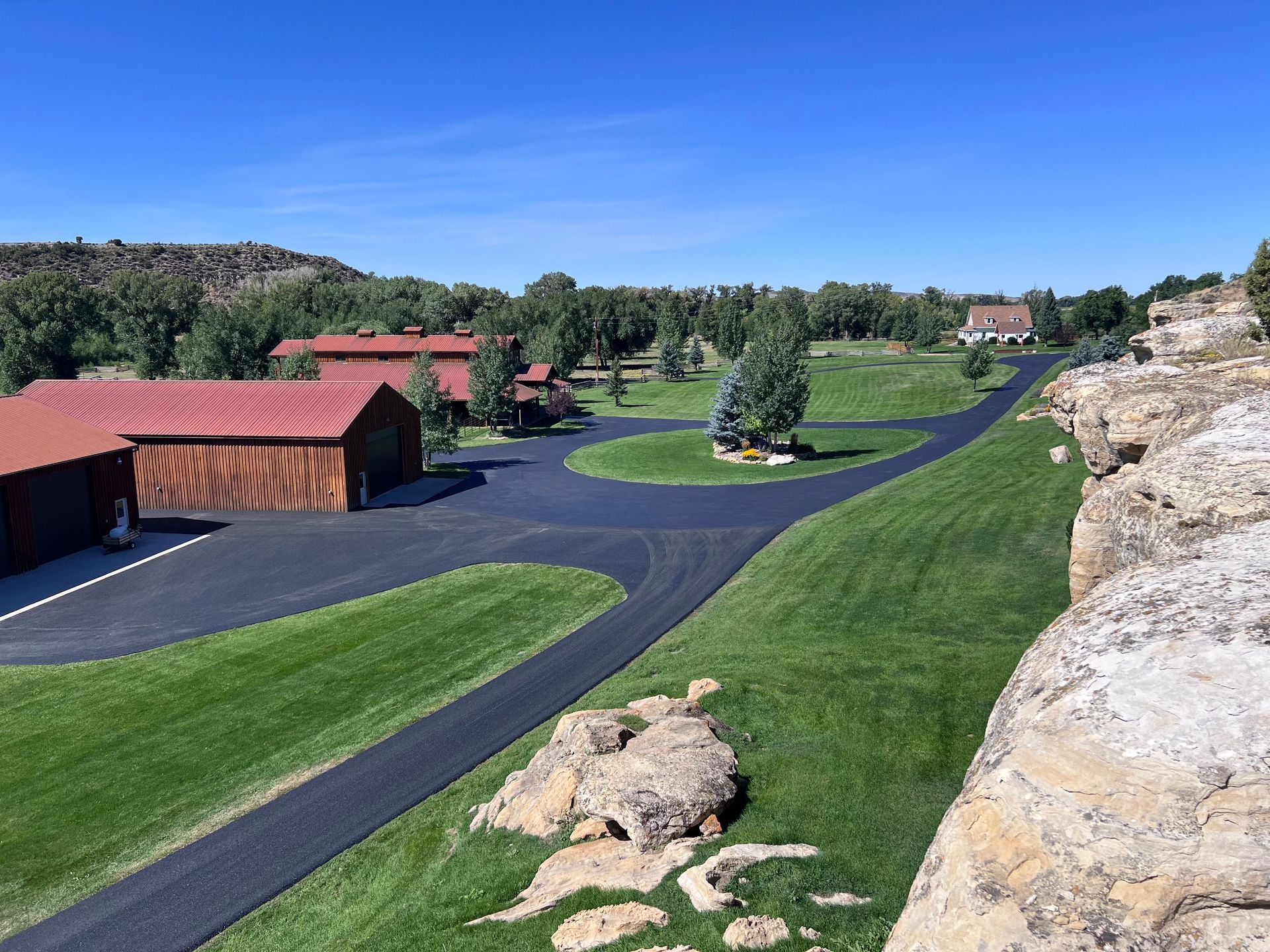 Picture of a chip sealed road in the middle of a natural reserve. 