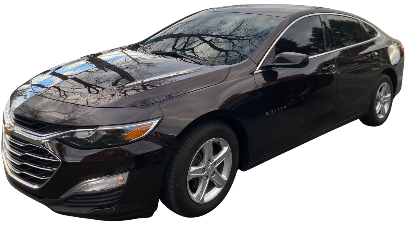 Dark brown Chevrolet Malibu sedan on a bright day.