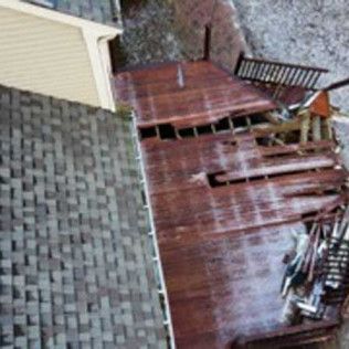 An aerial view of a wooden deck next to a house.