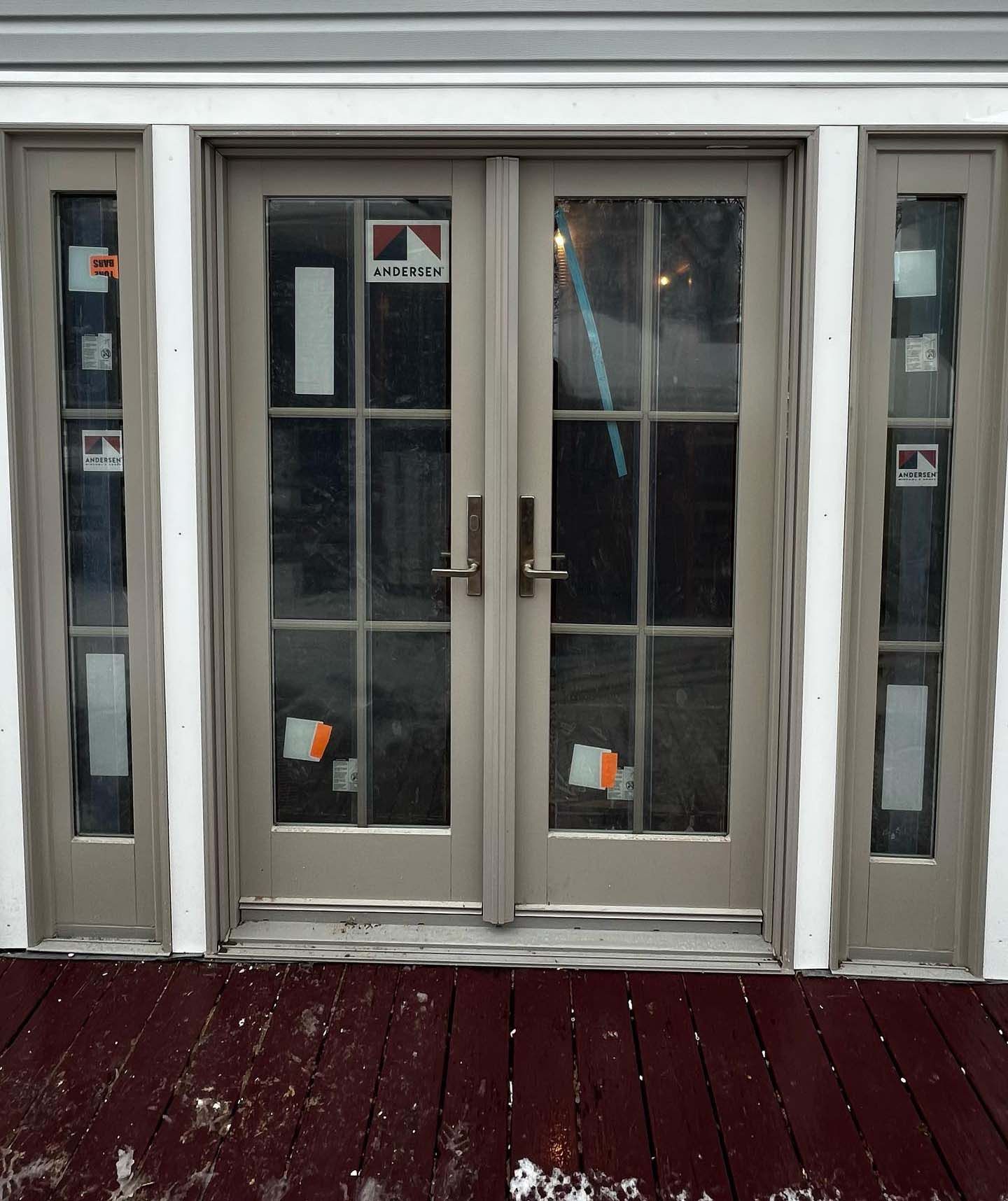 A door with a sticker on it that says ' sliding glass door '