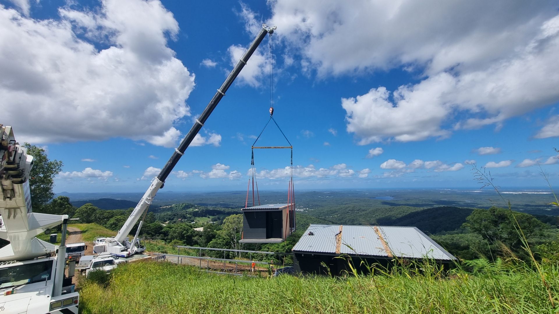 A Crane Lifting Up The Part Of The House— ProCert Cranes In Coolum Beach, QLD