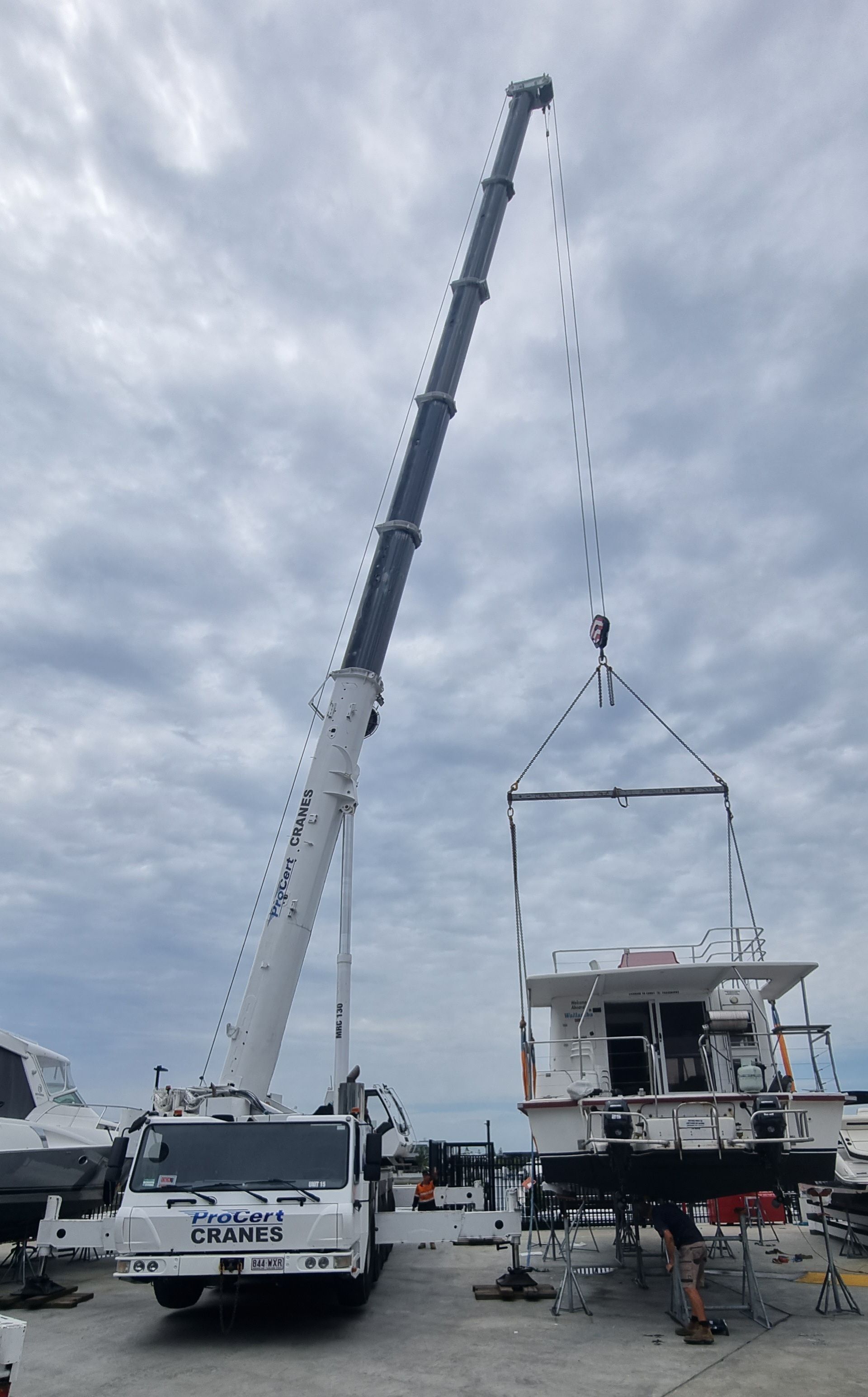 A Crane Is Lifting The Boat — ProCert Cranes In Coolum Beach, QLD