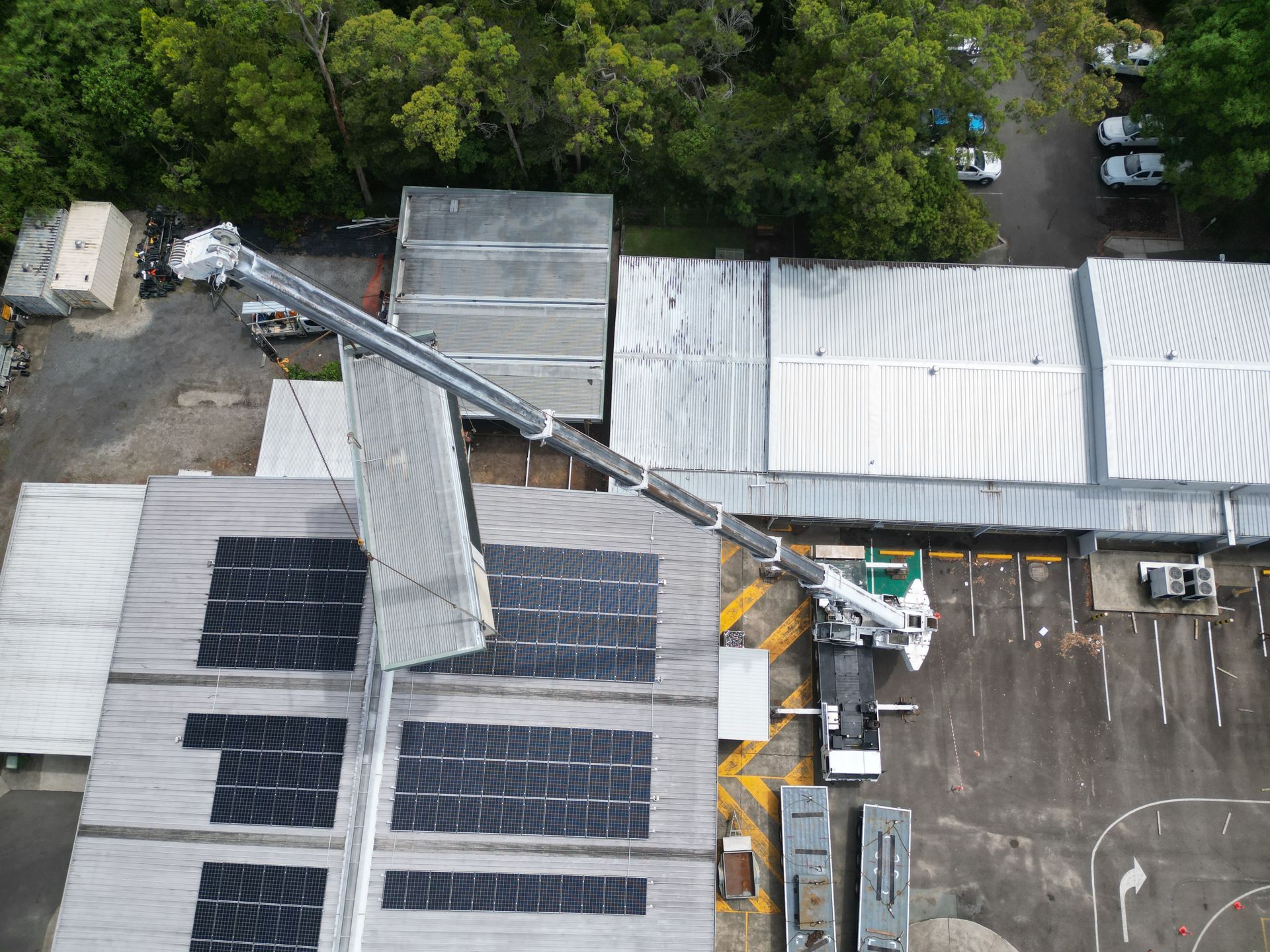 A Crane Is Lifting A Large Conteiner Box Into The Air — ProCert Cranes In Coolum Beach, QLD
